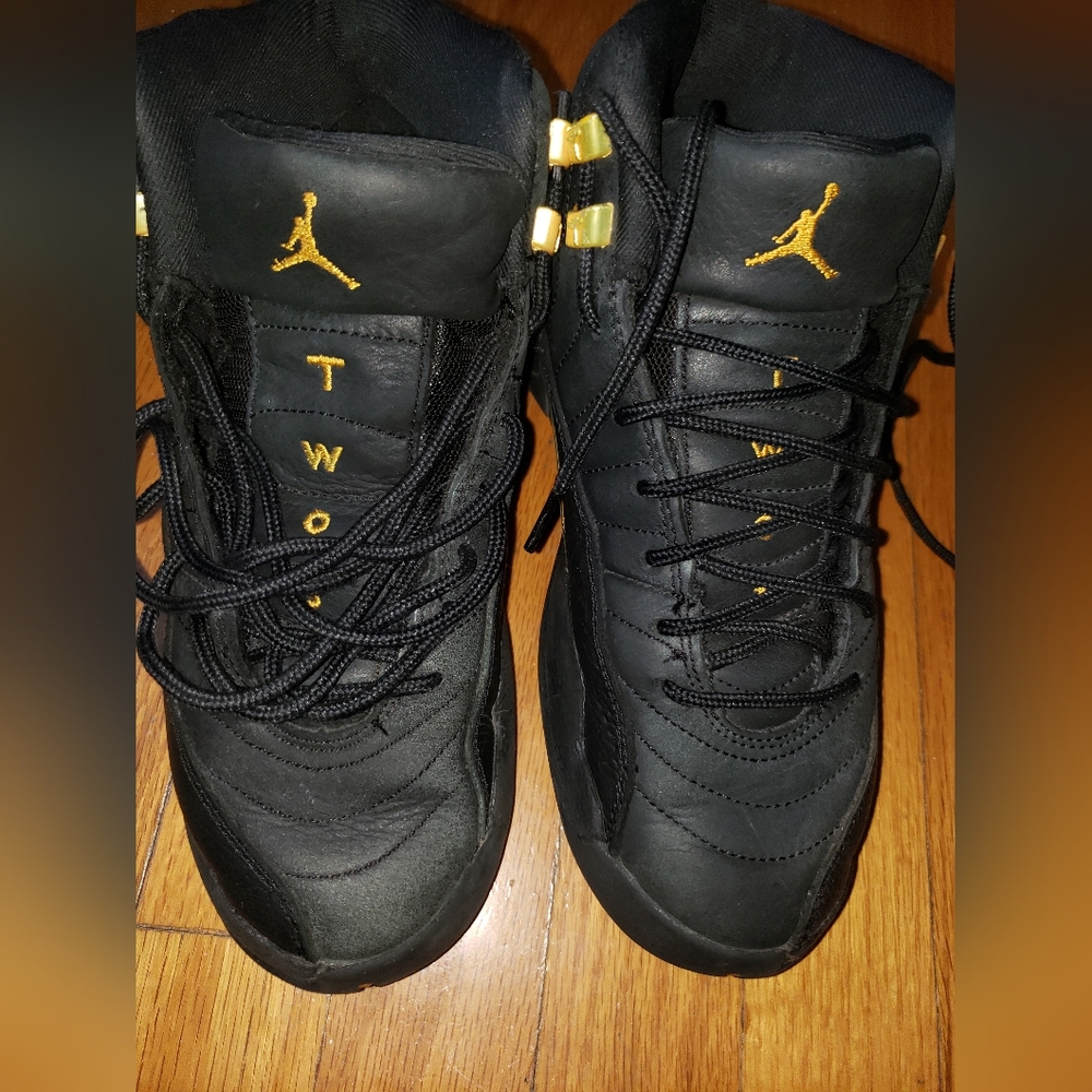 Boys size 5.5Y Nike Jordans Black and Gold